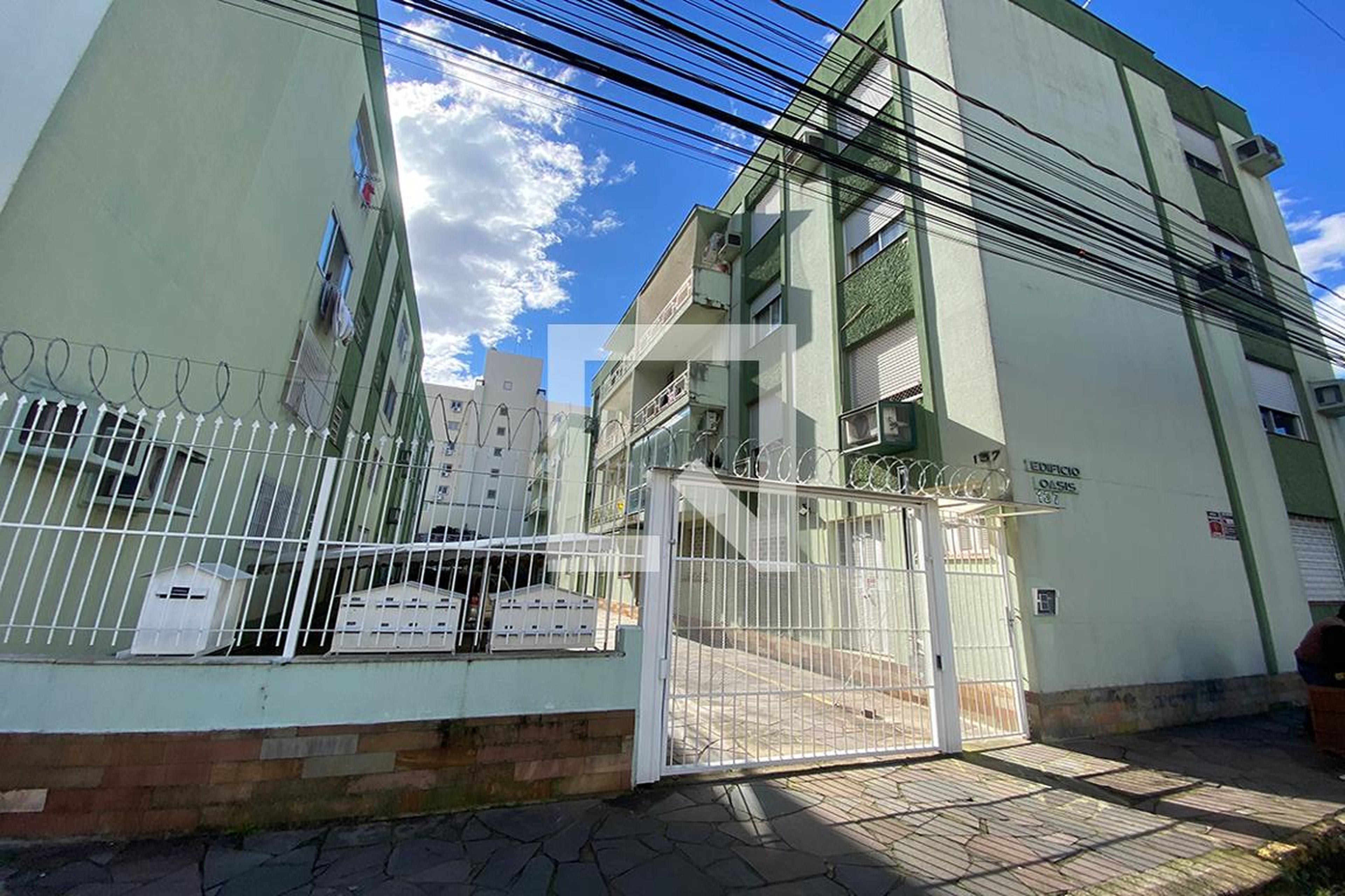 Fachada do Condomínio Condomínio Oasis