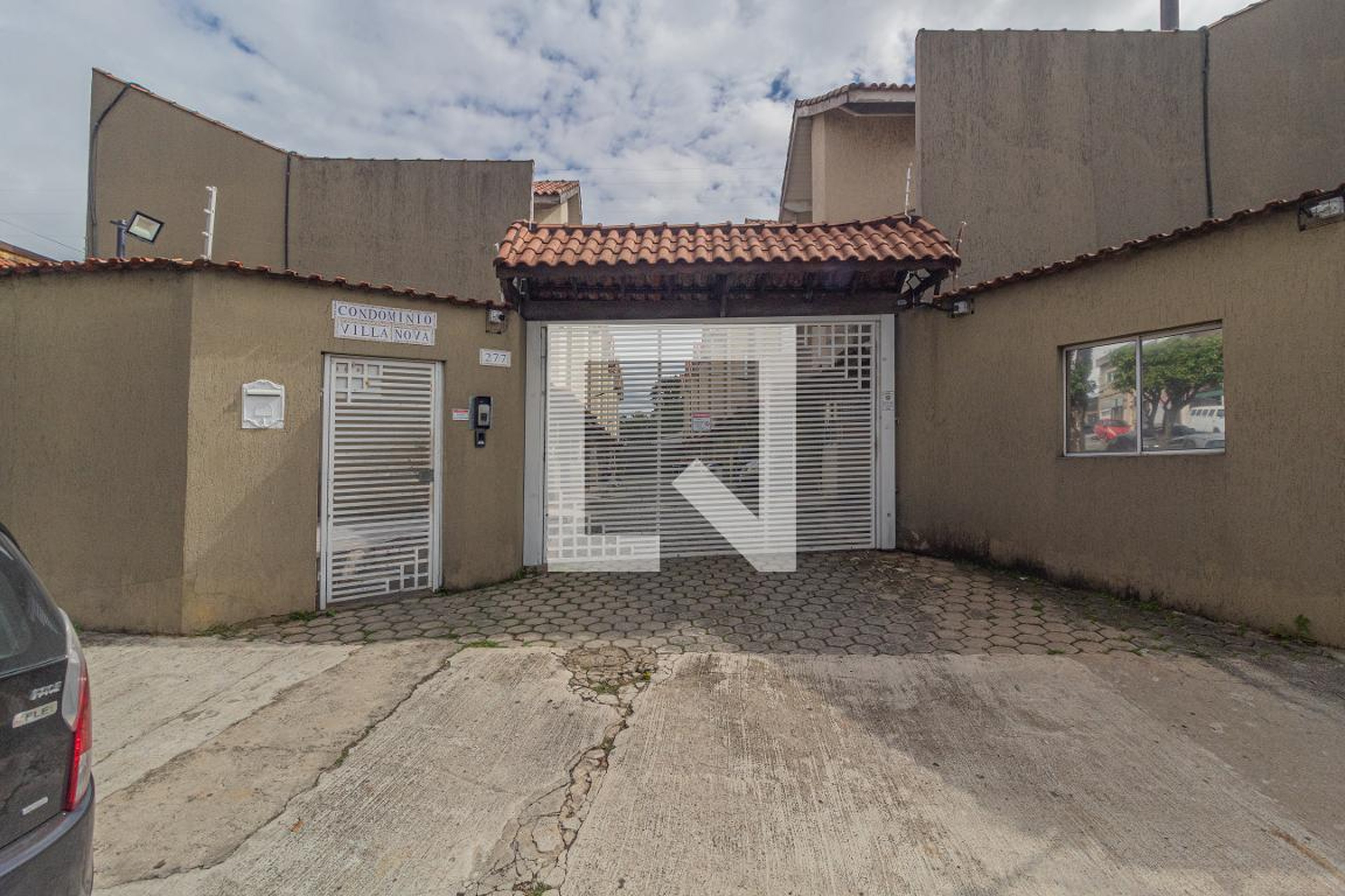 Fachada do Condomínio Condomínio Villa Nova