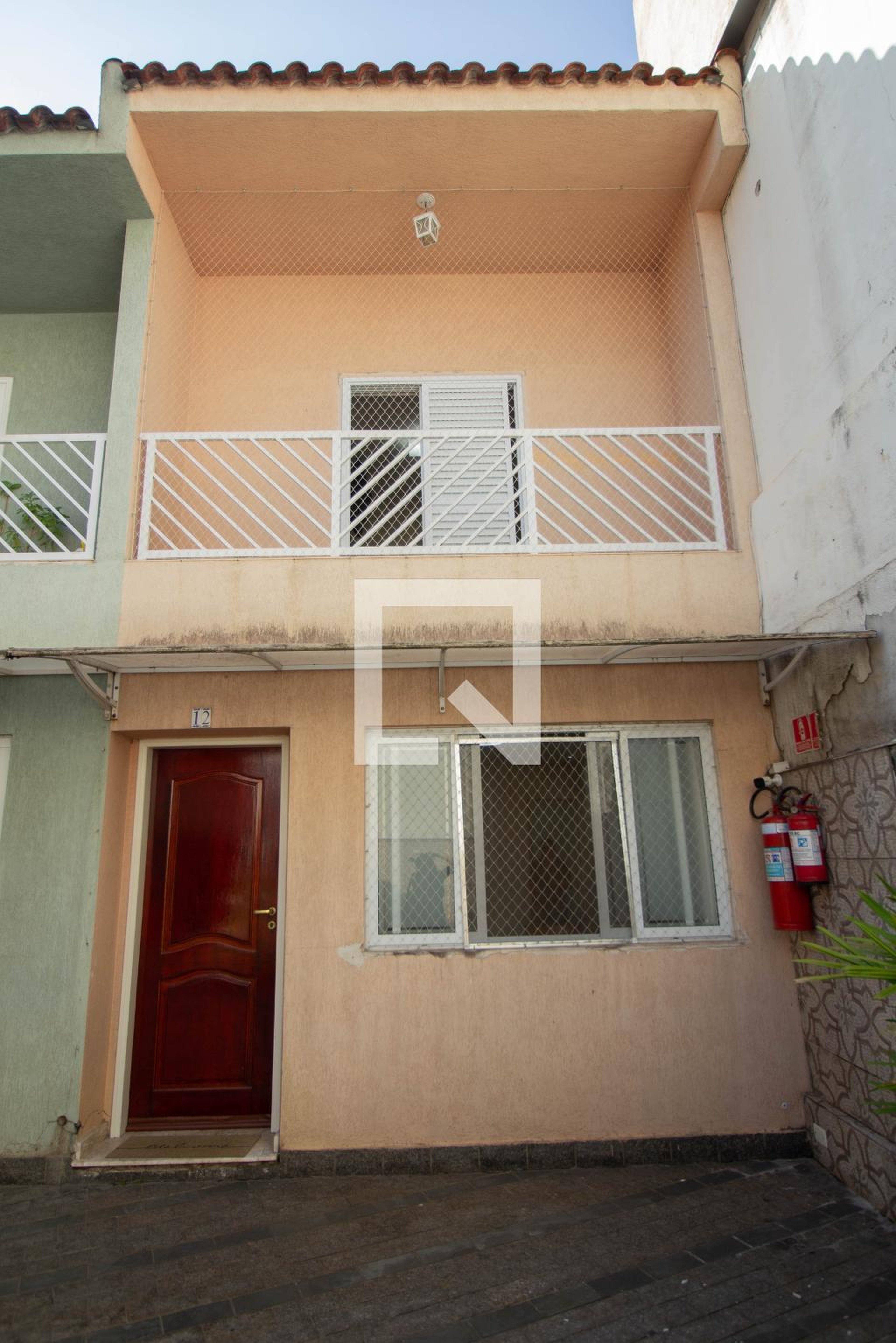 Fachada Condomínio em Rua Cônego Sangirardi, 26