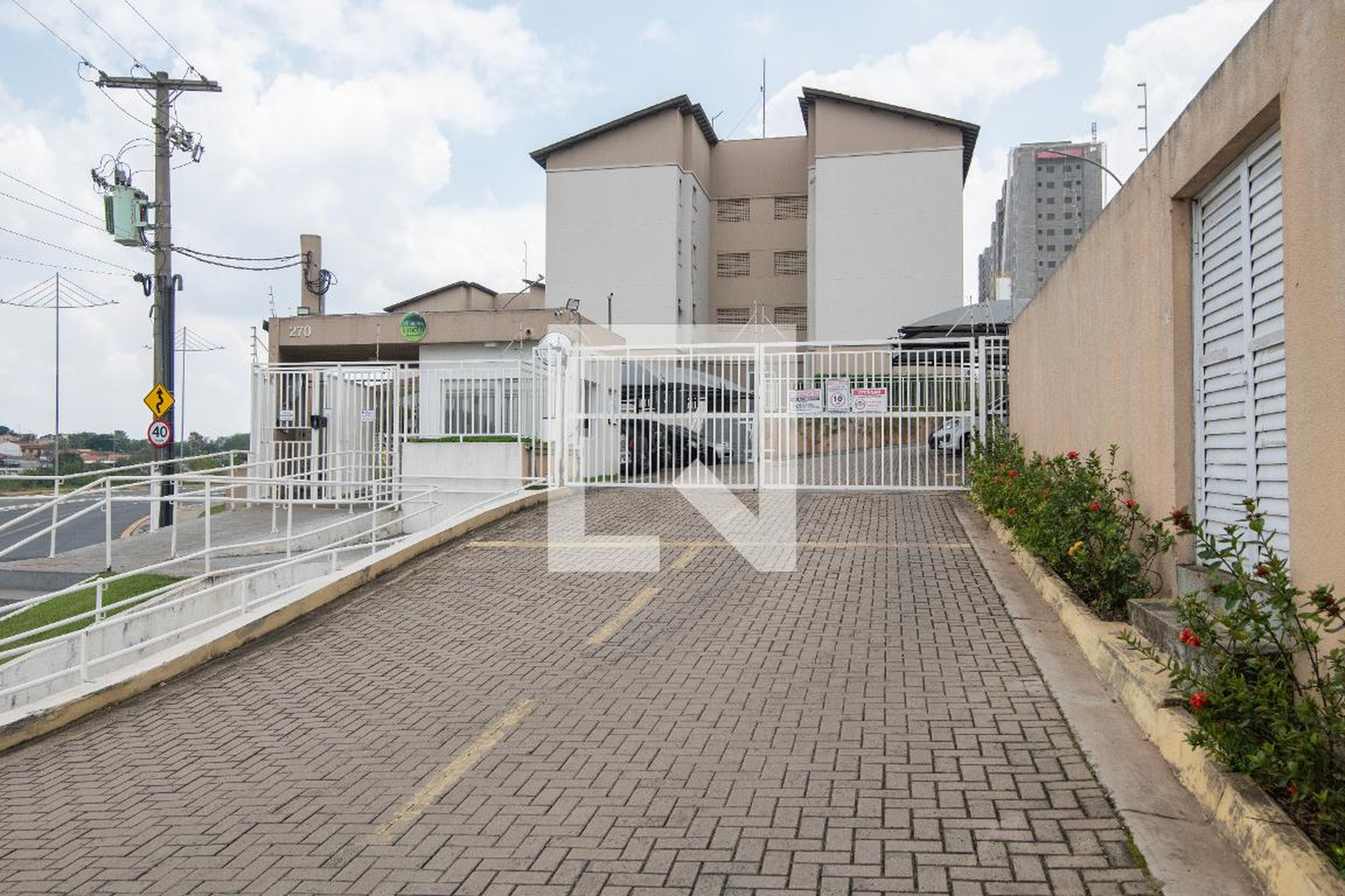 Fachada do Condomínio Condomínio Villagio do Horto