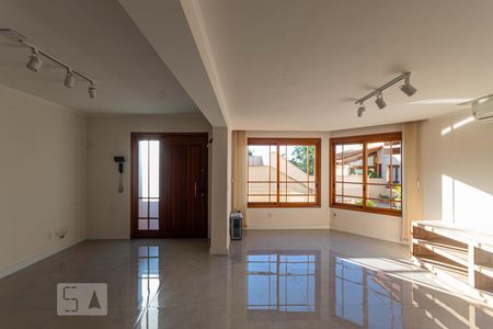 Sala de Estar de casa de condomínio à venda com 4 quartos, 214m² em Cristal, Porto Alegre