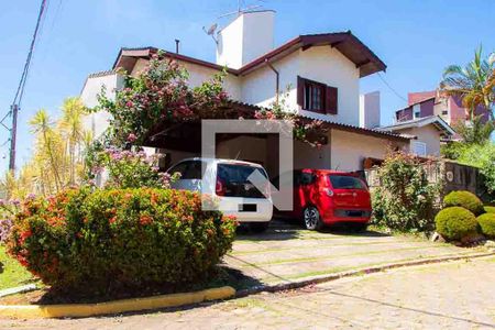 Casa de condomínio à venda com 208m², 4 quartos e 5 vagas Casa de condomínio à venda com 208m², 4 quartos e 5 vagasFachada
