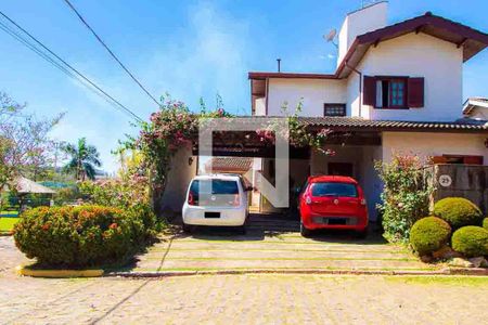 Casa de condomínio à venda com 208m², 4 quartos e 5 vagas Casa de condomínio à venda com 208m², 4 quartos e 5 vagasFachada