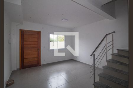 Sala de casa de condomínio para alugar com 2 quartos, 60m² em Vila Nova, Porto Alegre
