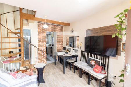 Sala de casa de condomínio à venda com 2 quartos, 70m² em Vila Nova, Porto Alegre