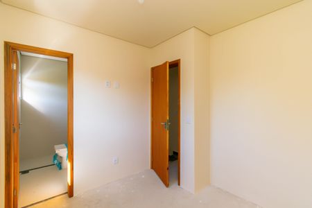 Casa de condomínio à venda com 76m², 2 quartos e 2 vagasSuíte 1