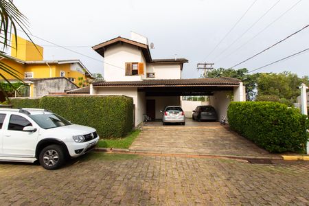 Casa de condomínio à venda com 230m², 3 quartos e 4 vagas Casa de condomínio à venda com 230m², 3 quartos e 4 vagasFachada
