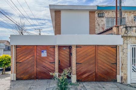 Casa à venda com 200m², 4 quartos e 3 vagasFachada + plaquinha