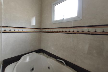 Casa de condomínio à venda com 334m², 4 quartos e 4 vagas Casa de condomínio à venda com 334m², 4 quartos e 4 vagasBanheiro da Suíte 1