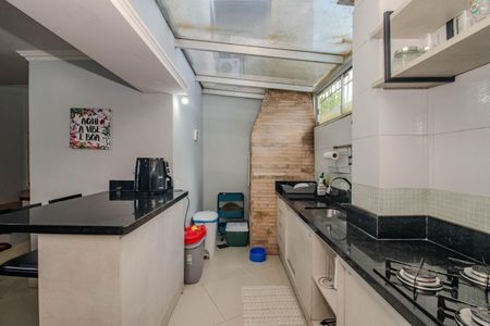 Casa de condomínio à venda com 128m², 3 quartos e 2 vagas Casa de condomínio à venda com 128m², 3 quartos e 2 vagasCozinha e Área de Serviço